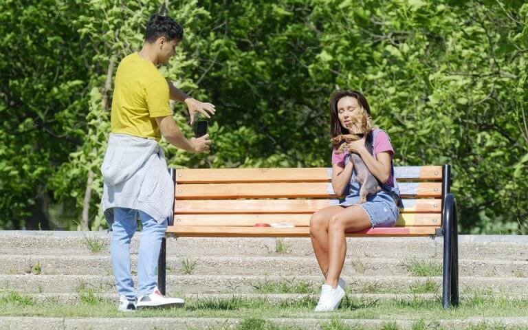 people taking photo with dog